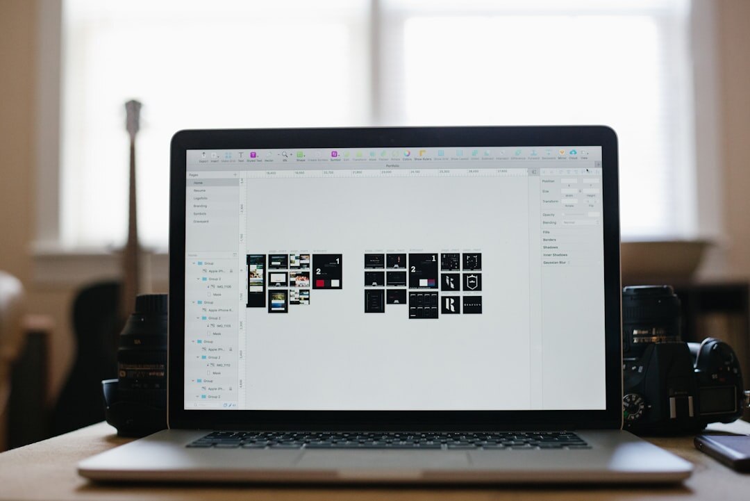 Laptop with website mockup on a desk with coffee and notebook