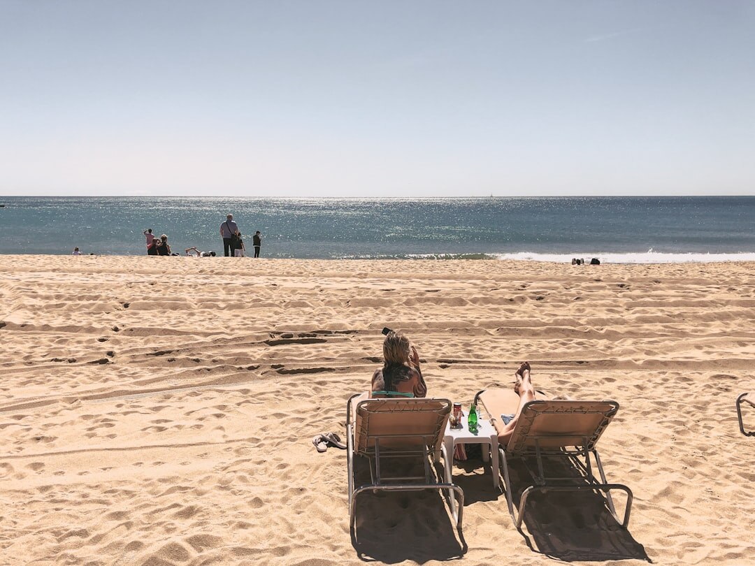 celebrity relaxing on beach